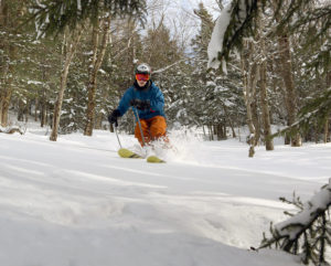 An image of Ty skiing powder in White Rabbit area of Bolton Valley Resort in Vermont 