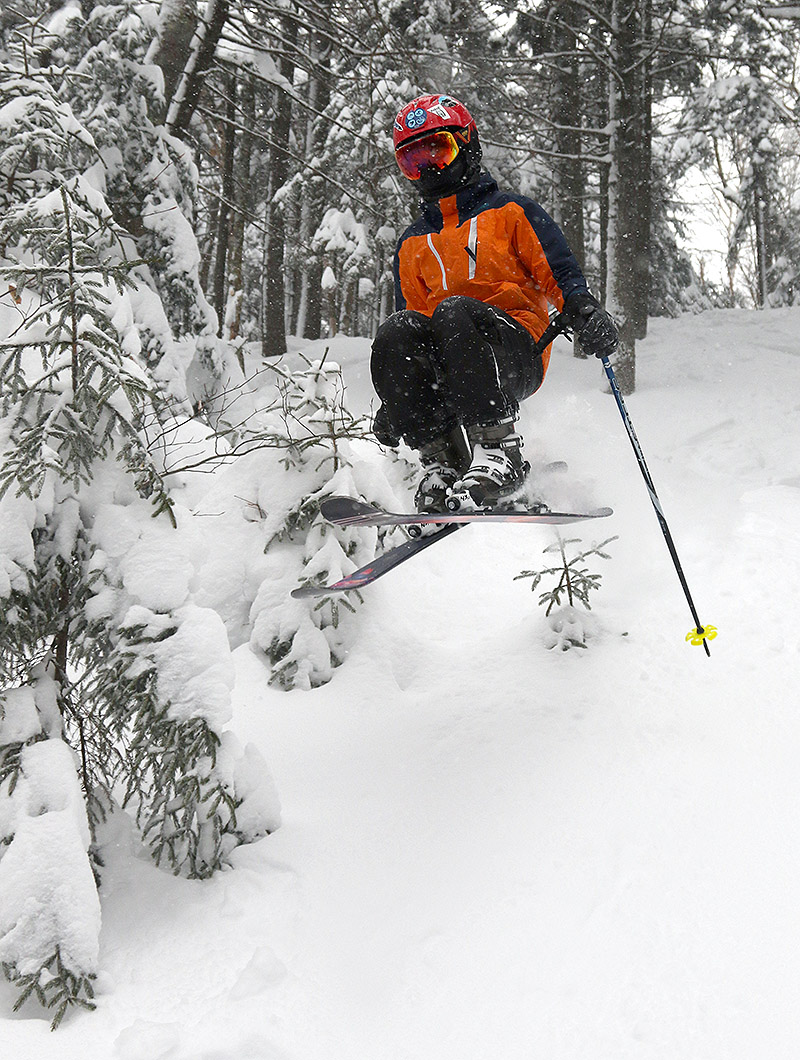 An image of Dylan jumping on his skis in the Thundergoat Pass area at Bolton Valley Ski Resort in Vermont