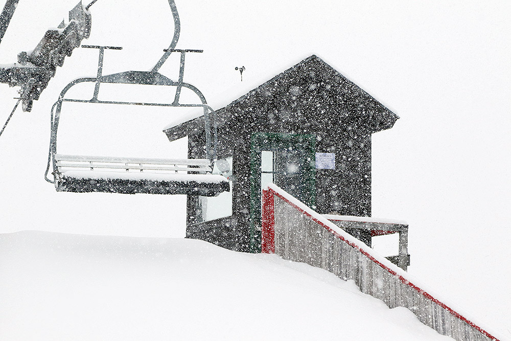 An image of heavy snowfall at the Timberline Mid Station area at Bolton Valley Ski Resort in Vermont