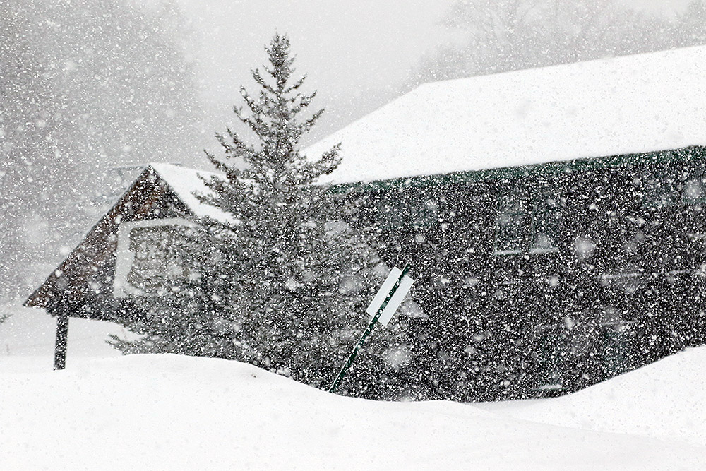 An image showing very heavy snowfall at the Timberline Base at Bolton Valley Ski Resort in Vermont