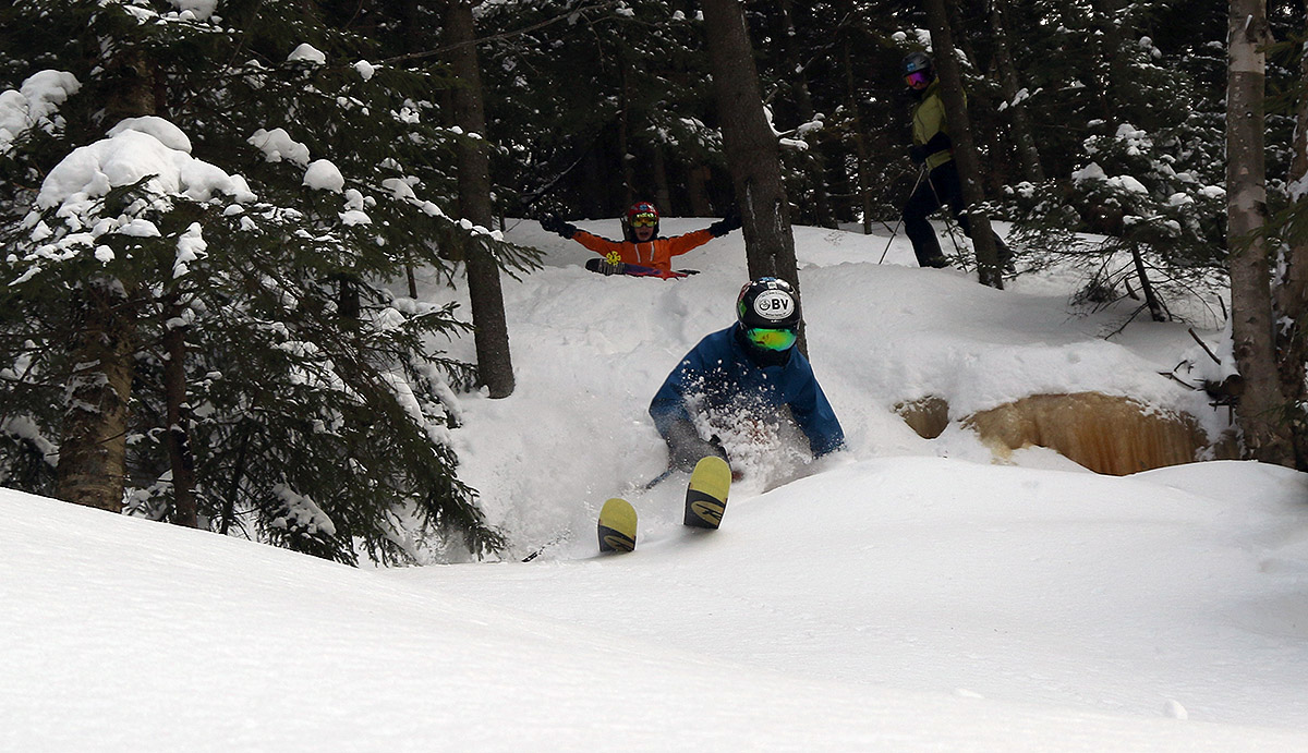 An image of Ty skiing powder with Dylan and Erica looking on in the KP Glades area at Bolton Valley Resort in Vermont