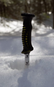 An image of a ski pole in the snowpack at Bolton Valley Ski Resort in Vermont