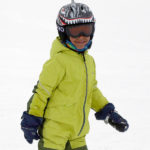 Adrian dressed in his ski gear and smiling at Stowe Mountain Resort in Vermont