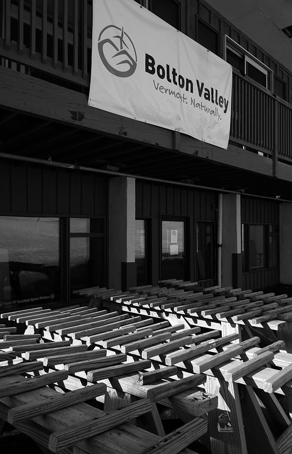 An image of ski racks stacked up behind the main base lodge at Bolton Valley Ski Resort in Vermont