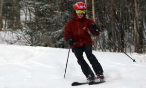 An image of Dylan skiing in the Wilderness area at Bolton Valley Resort in Vermont in mid-December after a couple of small snowfalls