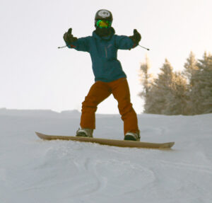 An image of Ty on his snowboard on the Alta Vista trail at Bolton Valley Resort in Vermont
