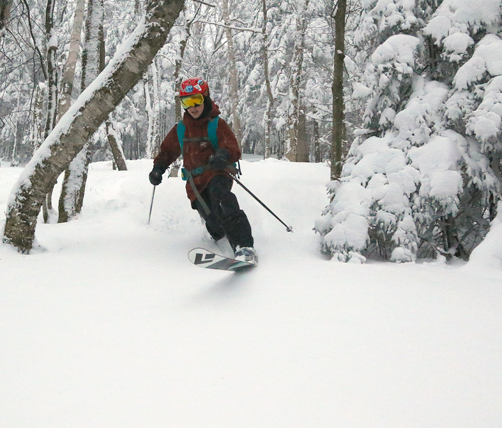 An image of Dylan Telemark skiing in some January powder on the backcountry network at Bolton Valley Resort in Vermont