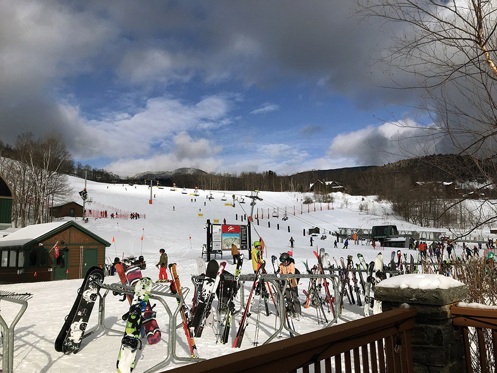 An image of a beautiful February day at the base of the Spruce Peak area at Stowe Mountain Resort in Vermont