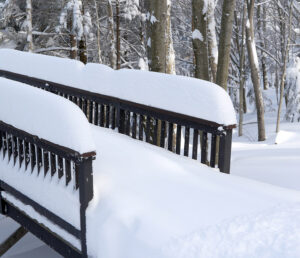 An image of railings covered with fresh snow on a slopeside house at Bolton Valley Resort in Vermont after Winter Storm Kade