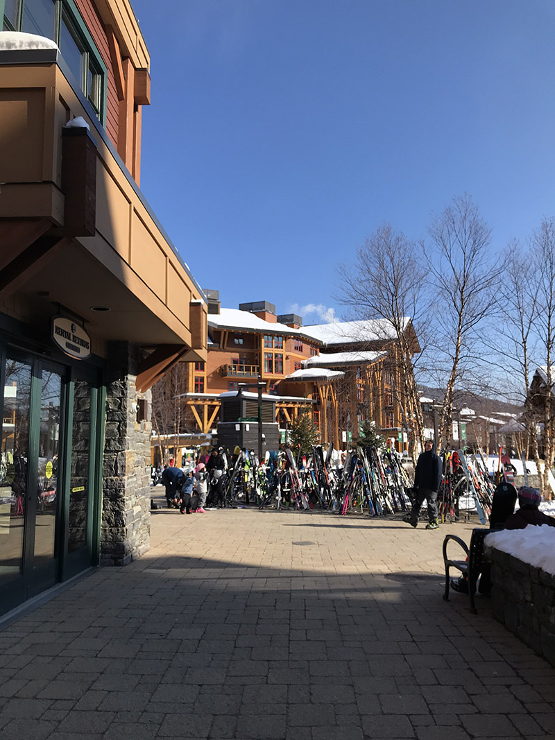 An image from the Spruce Peak Village at Stowe Mountain Ski Resort in Vermont on a sunny February day.