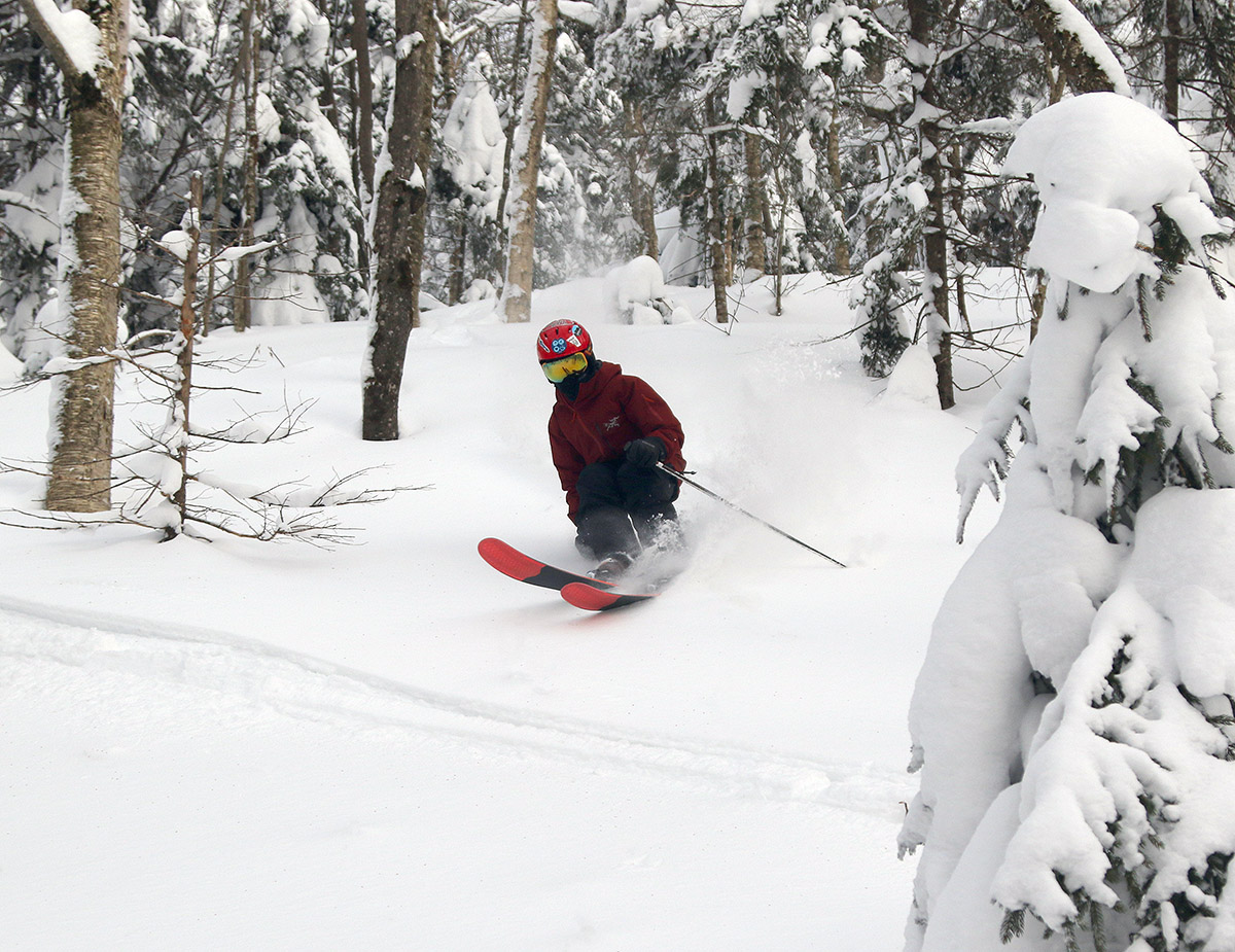 An image of Dylan skiing powder at Bolton Valley Resort in Vermont