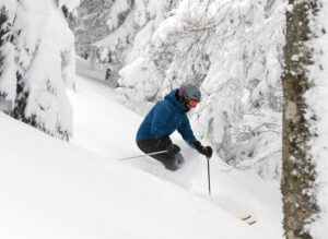 An image of Erica skiing powder from Winter Storm Odell at Bolton Valley Resort in Vermont