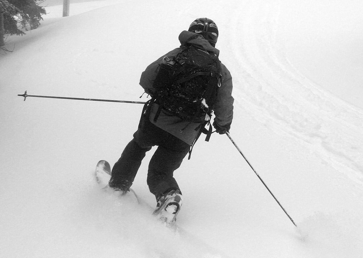 An image of Jay from behind as he Telemark skis in powder from Winter Storm Quincy at Bolton Valley Resort in Vermont