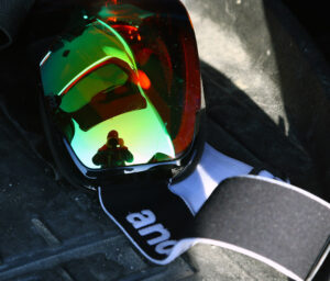 An image of ski goggles with a reflection at the end of a ski tour by the Timberline base area of Bolton Valley Resort in Vermont