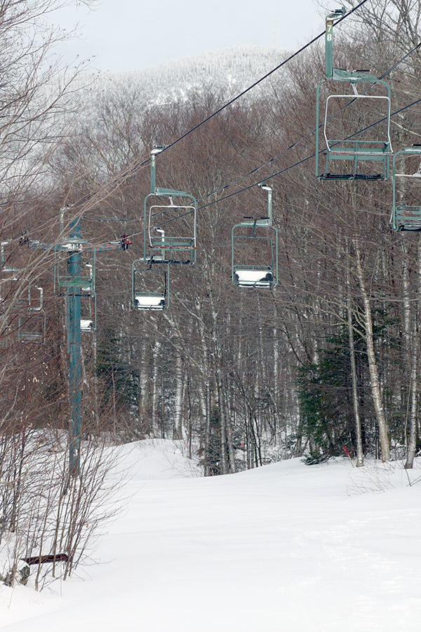An image of the Wilderness Chairlift with a fresh coating a of April snow at Bolton Valley Ski Resort in Vermont
