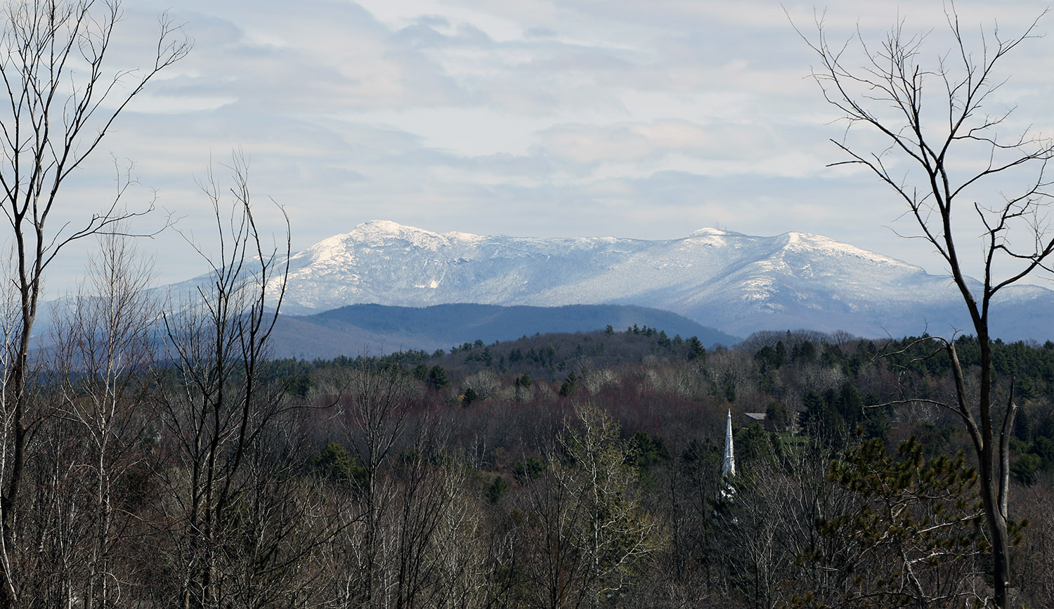 An image taken from Interstate 89 of Mount Mansfield in Vermont covered with snow after a late-April snowstorm