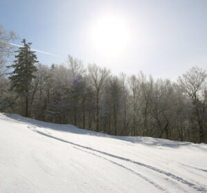 An image of a ski track in powder snow after some small storms dropped 8 to 10 inches at Bolton Valley Ski Resort in Vermont