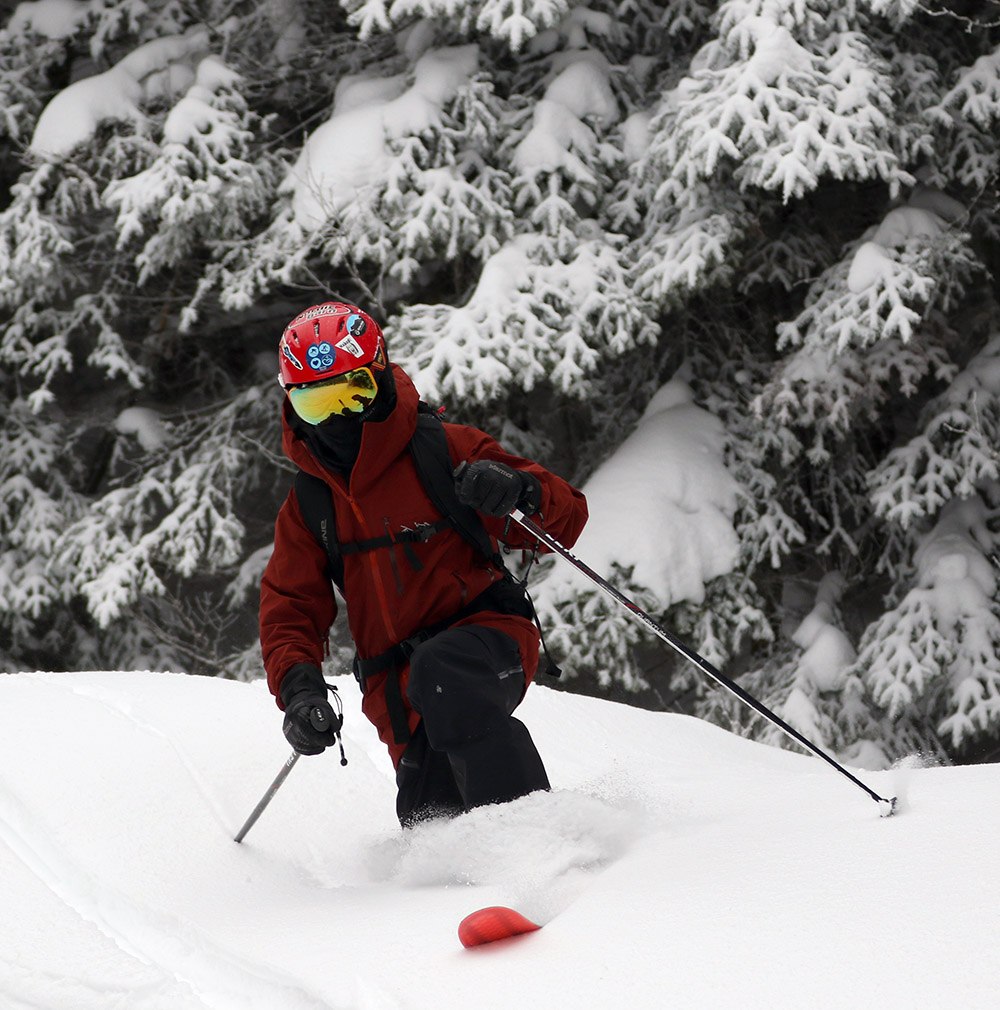 An image of Dylan Telemark skiing in powder from Winter Storm John at Bolton Valley Resort in Vermont