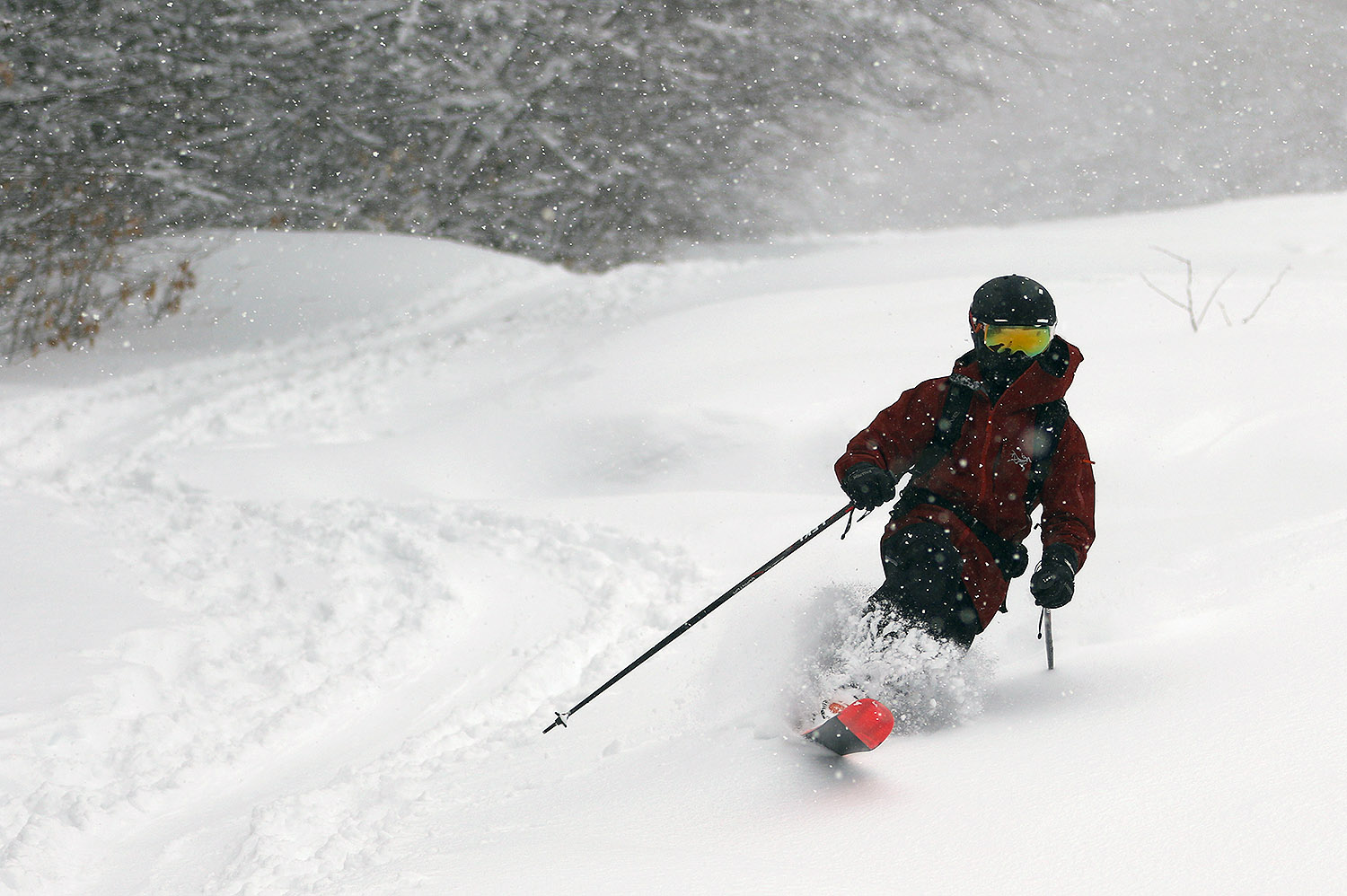 An image of Dylan Telemark skiing in fresh powder from Winter Storm Malcolm while we wait for the Timberline Quad chair to start loading at Bolton Valley Ski Resort in Vermont