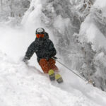 An image of Ty skiing through fresh snow from Winter Storm Malcolm on the Hard Luck trail at Bolton Valley Ski Resort in Vermont