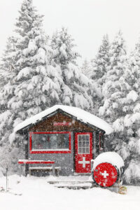 An image of the ski patrol hut at the Timberline Summit area during some heavy morning snowfall at Bolton Valley Ski Resort in Vermont