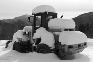 An image of a bucket loader covered with snow on a ski tour of the Nordic and Backcountry trail network at Bolton Valley Ski Resort in Vermont