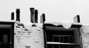 An image of snow on the roof of the hotel in the Village at Bolton Valley Ski Resort in Vermont