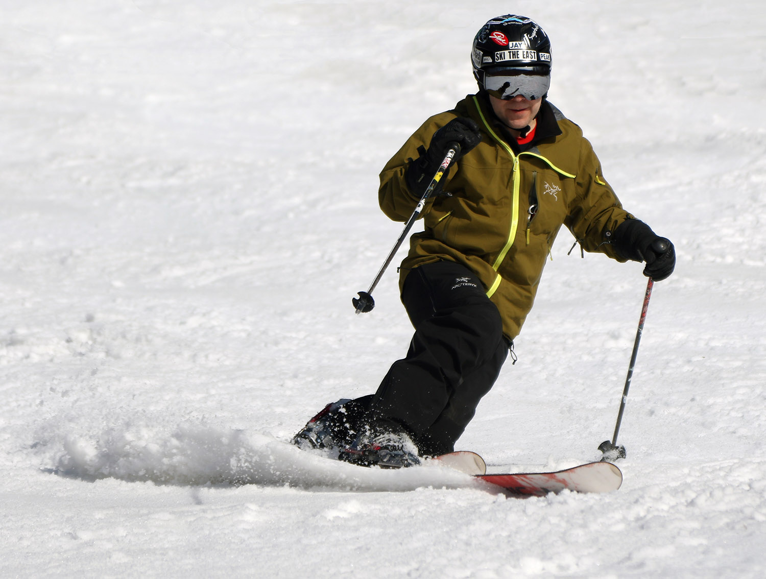 An image of Jay Telemark skiing in spring snow on the Showtime trail at Bolton Valley Ski Resort in Vermont