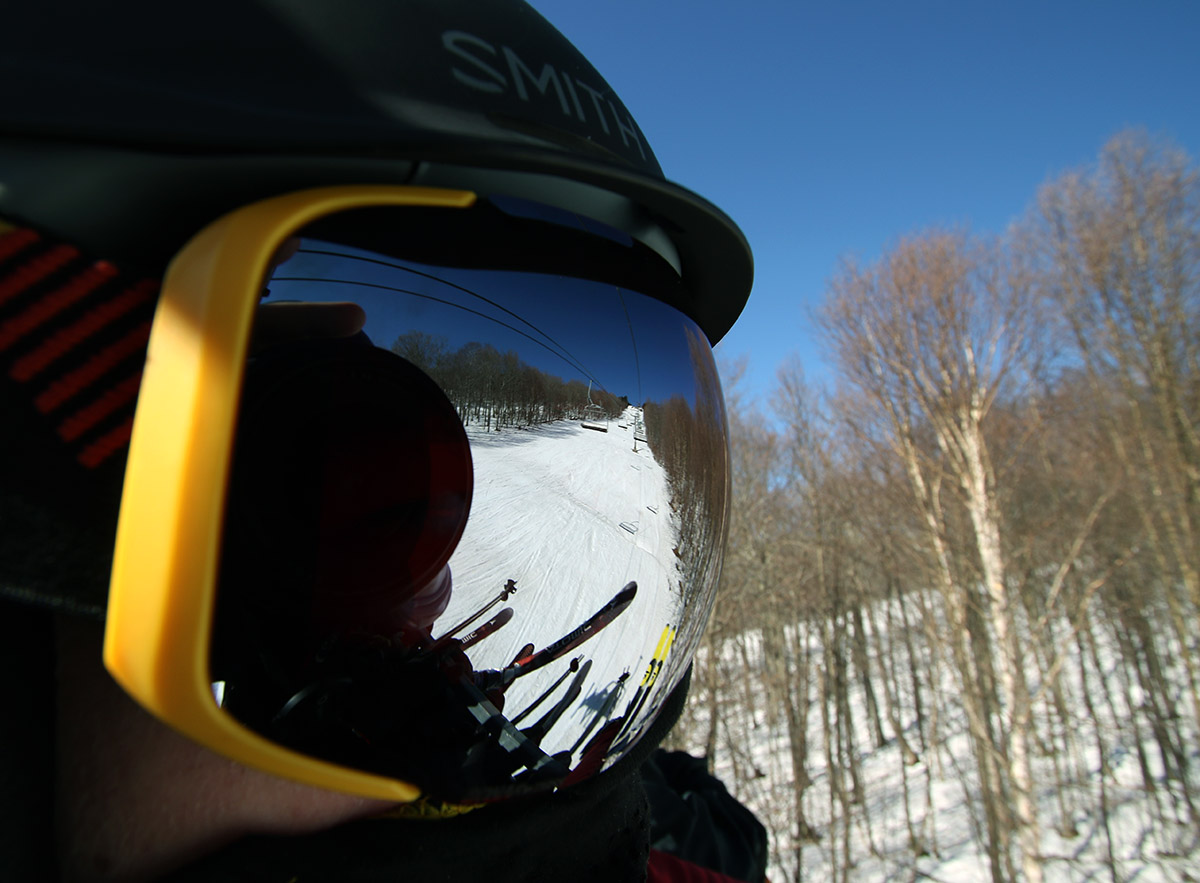 An image of a ski trail off reflective goggles while on the Timberline Quad Chairlift at Bolton Valley Ski Resort in Vermont