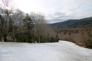 An image showing part of the Hard Luck ski trail on an April day at Bolton Valley Ski Resort in Vermont