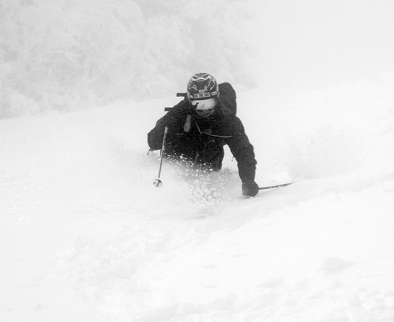 An imager of Jay Telemark skiing in some deep powder after an April snowstorm at Pico Mountain Ski Resort in Vermont