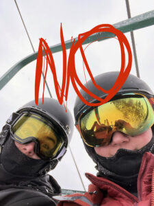 An image of Colin and Dylan riding a chair lift and denying they're out for some powder on their snow day during Winter Storm Jaden at Bolton Valley Ski Resort in Vermont