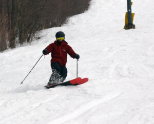 An image of Dylan skiing the Showtime trail in the Timberline area of Bolton Valley Ski Resort in Vermont