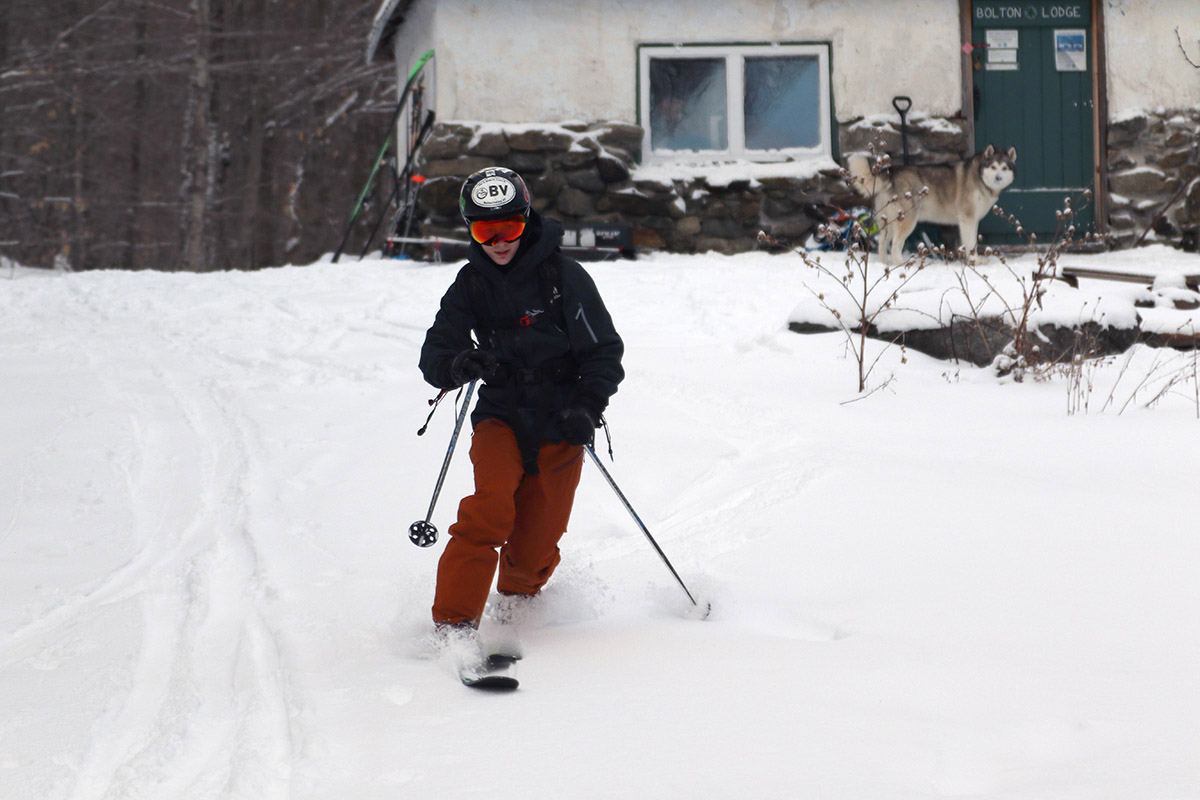 An image of Ty Telemark skiing by the Bolton Lodge on the Nordic and Backcountry Network at Bolton Valley Resort in Vermont