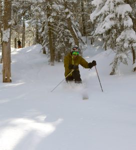 An image of Jay skiing off piste in the powder from Winter Storm Oaklee at Bolton Valley Ski Resort in Vermont