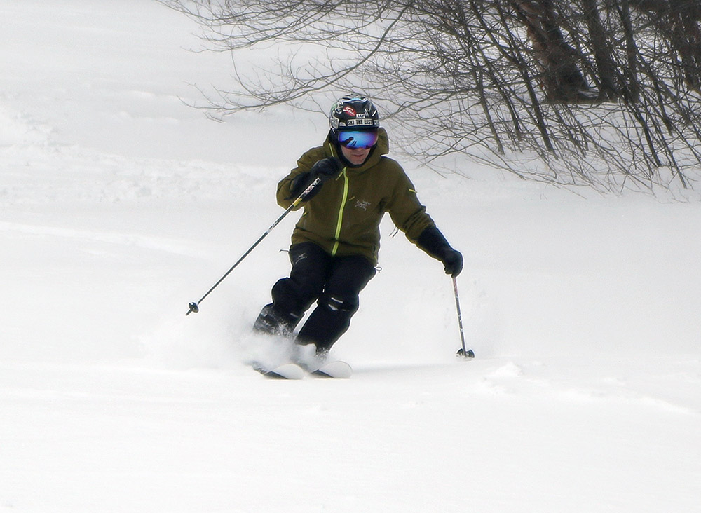 An image of Jay skiing powder from Winter Storm Quinlan on the Spell Binder Trail of the Timberline area at Bolton Valley Ski Resort in Vermont