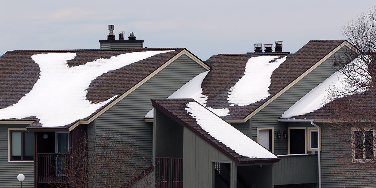 An image of a roof with snow in the Bolton Valley Village after and early April snowstorm hit Bolton Valley Ski Resort in Vermont