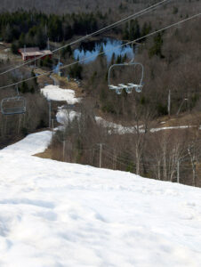 An image looking down the Spillway trail on a ski tour in May at Bolton Valley Resort in Vermont