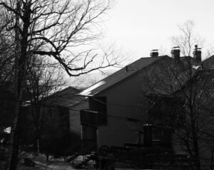 An image of the Wentworth Condos in the village area behind the base of the Snowflake Chairlift on a November ski day at Bolton Valley Ski Resort in Vermont