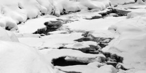 An image of a frozen river while on a ski tour of the Nordic and Backcountry Network at Bolton Valley Resort in Vermont