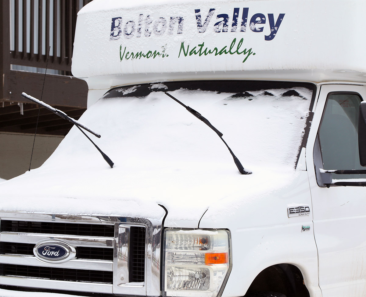 A shuttle bus with a bit of January snow in the Village area at Bolton Valley Ski Resort in Vermont