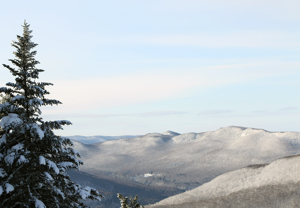 An image looking southwest into the Green Mountains from atop the Spell Binder trail at Bolton Valley Ski Resort in Vermont