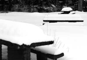 An image of picnic tables covered with snow along Route 118 in the Montgomery area of Vermont
