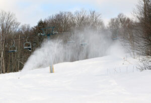 An image of snow guns making snow near the base of the Timberline area at Bolton Valley Ski Resort in Vermont