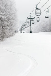 An image of ski tracks in powder snow on the Wilderness Liftline trail at Bolton Valley Ski Resort in Vermont
