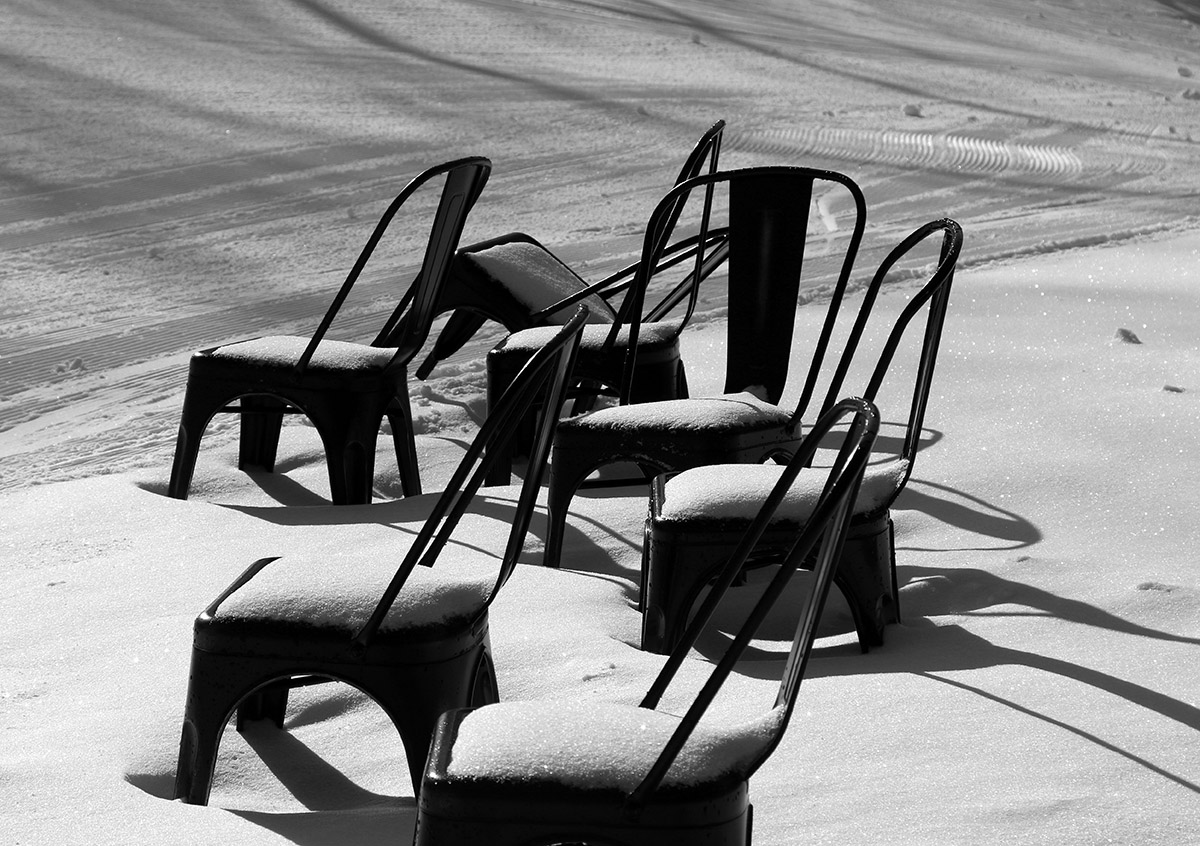 An image of a collection of chairs in the snow on a morning ski tour at the Timberline Base Are of Bolton Valley Resort in Vermont