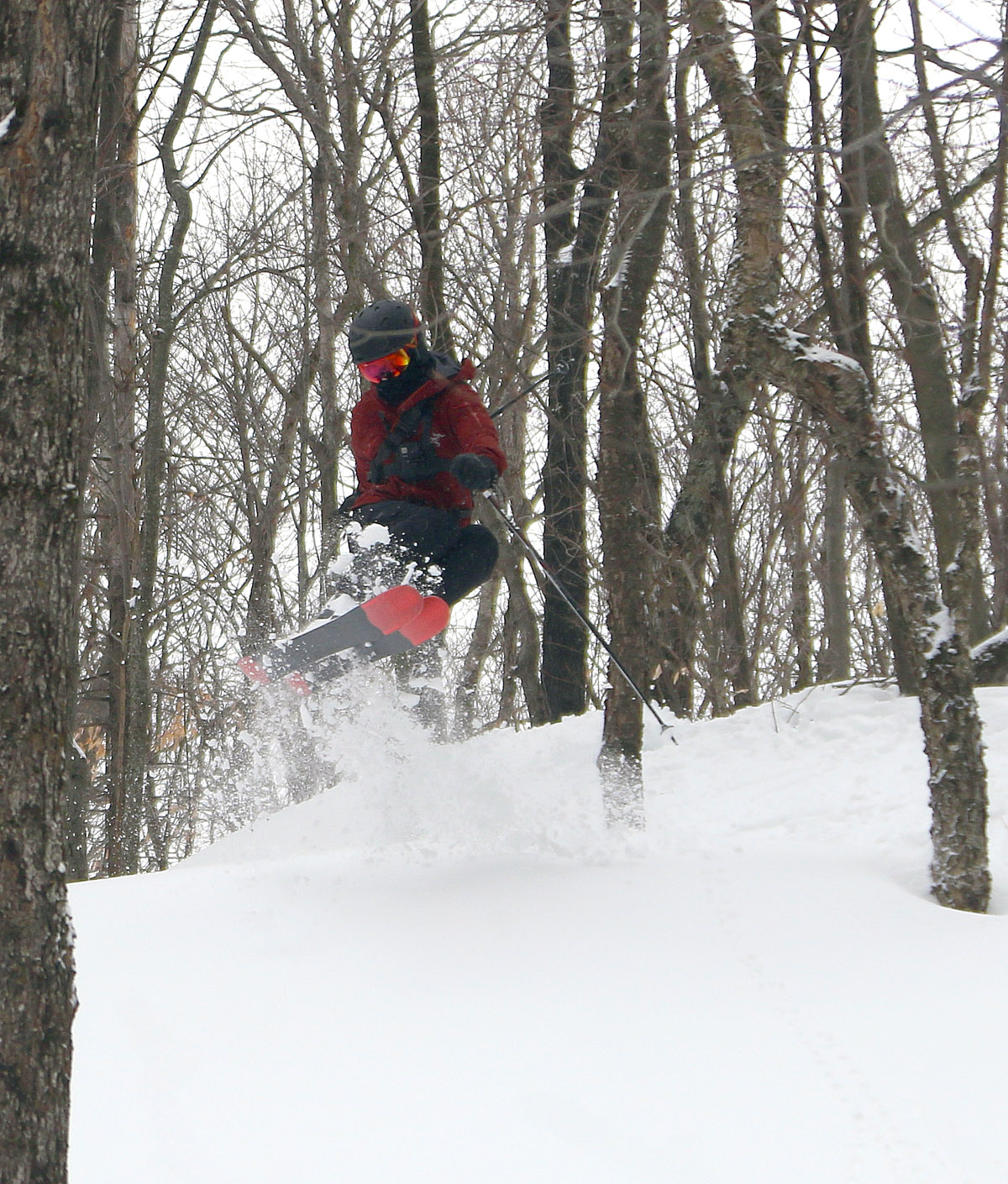 An image of Dylan jumping in powder snow from Winter Storm Quest at Bolton Valley Ski Resort in Vermont