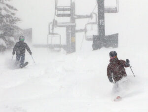 An image of Dylan and Colin blasting through deep powder while skiing on the Wilderness Liftline during Winter Storm Sage at Bolton Valley Resort in Vermont
