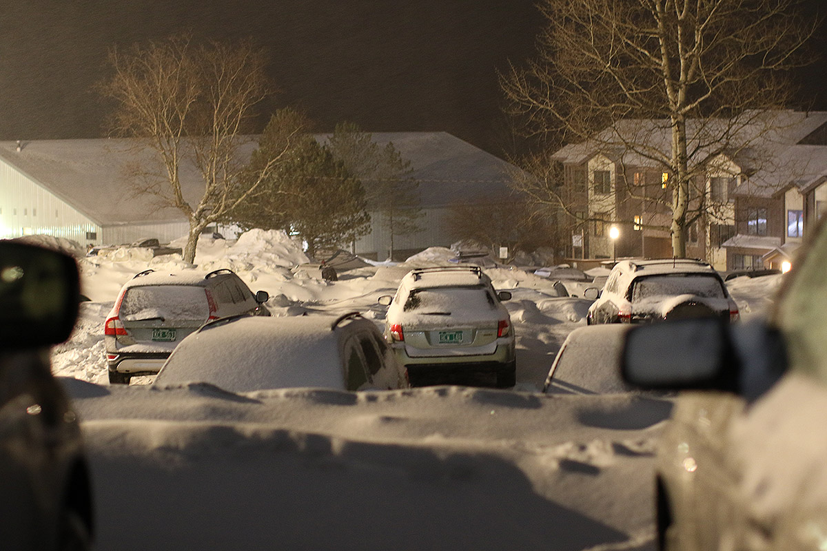 An image of cars in the Village parking lot during Winter Storm Uriel at Bolton Valley Ski Resort in Vermont