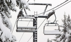 An image of the Timberline Quad Chairlift during an early December snowstorm at Bolton Valley Ski Resort in Vermont